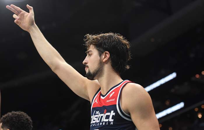 Washington Wizards forward Deni Avdija (8) reacts after his team scores during the second half against the Charlotte Hornets at the Spectrum Center.